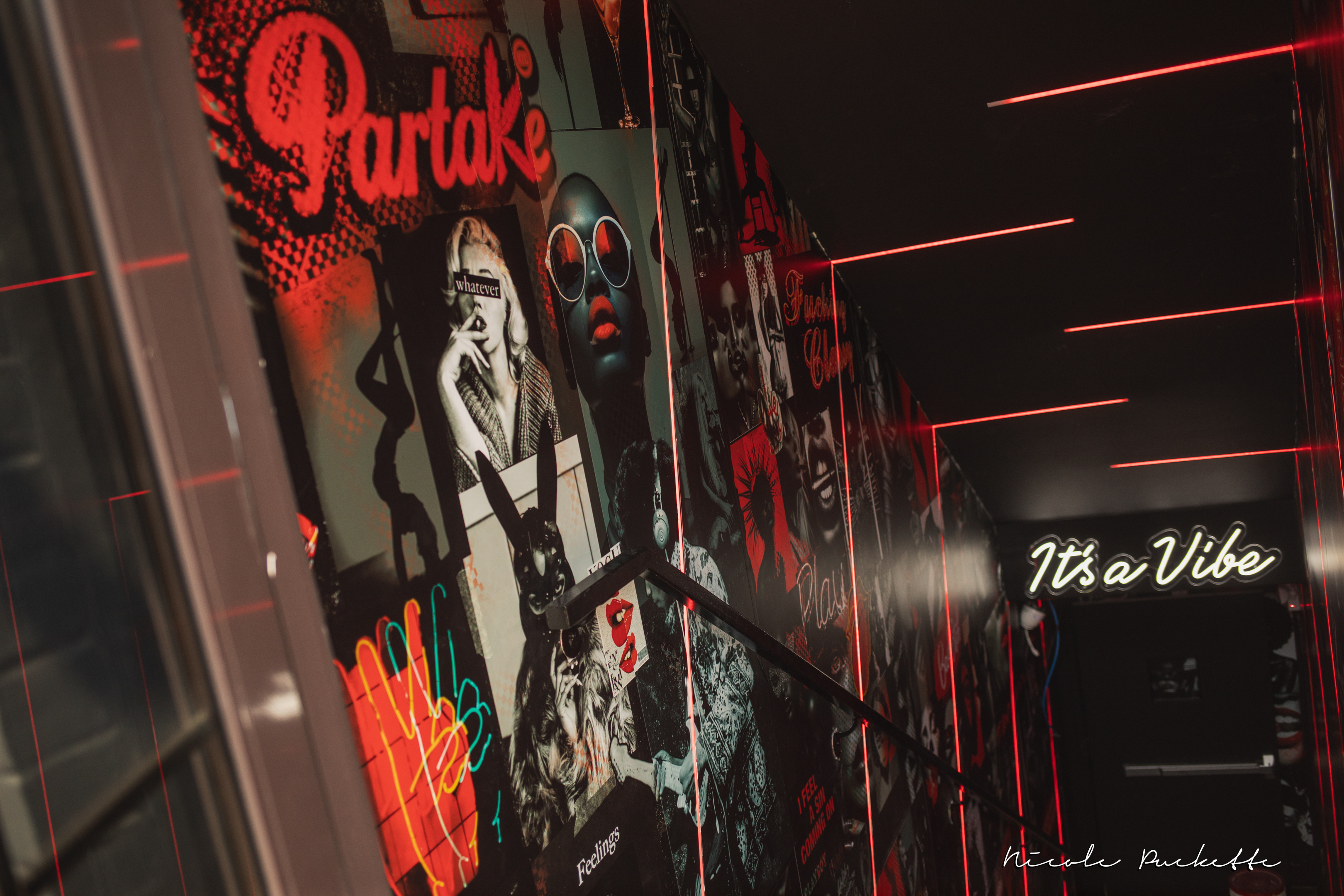 The neon ‘It's a Vibe’ stairwell at Partake NYC in Long Island City